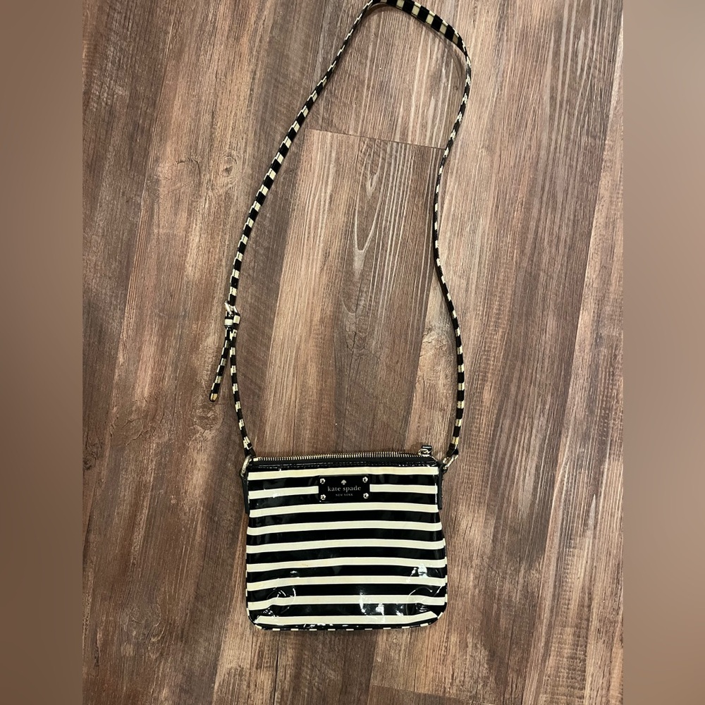 Kate Spade New York Flicker Tenley black and cream patent cowhide crossbody bag.